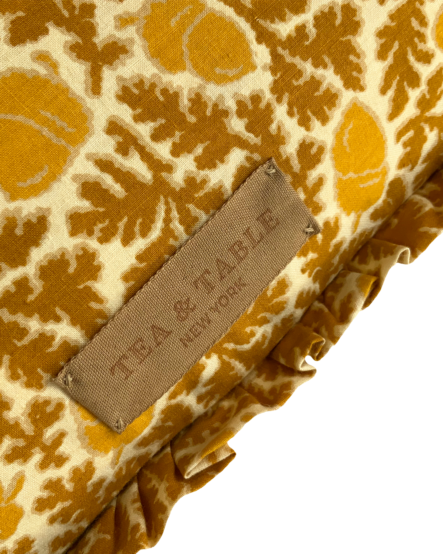 Cushion in “Acorn” Print with Ruffles in yellow/ochre