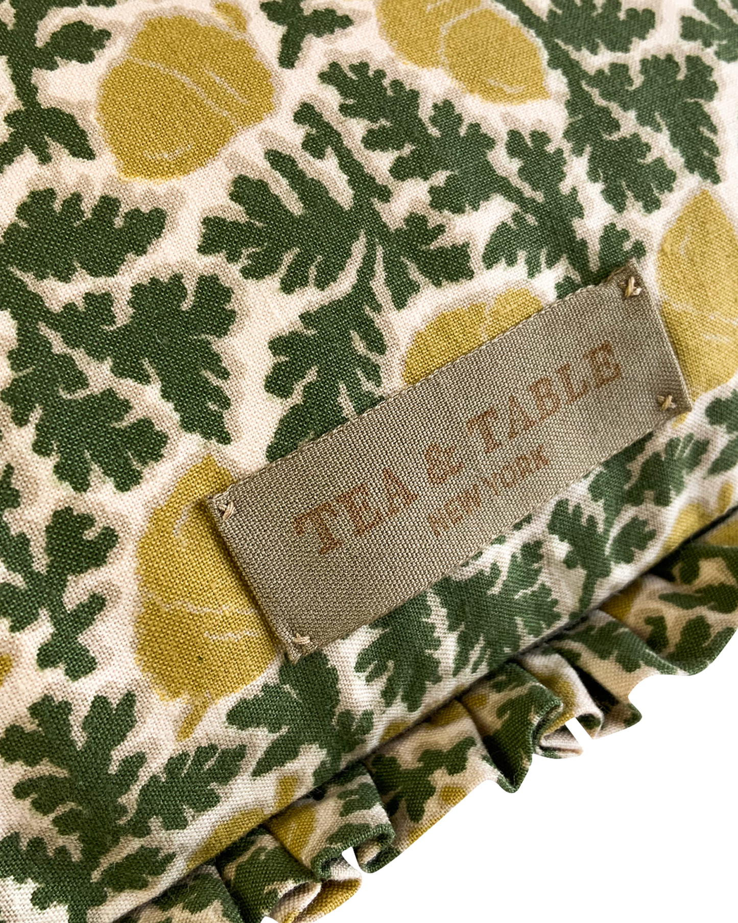 Cushion in “Acorn” Print with Ruffles in green/mustard